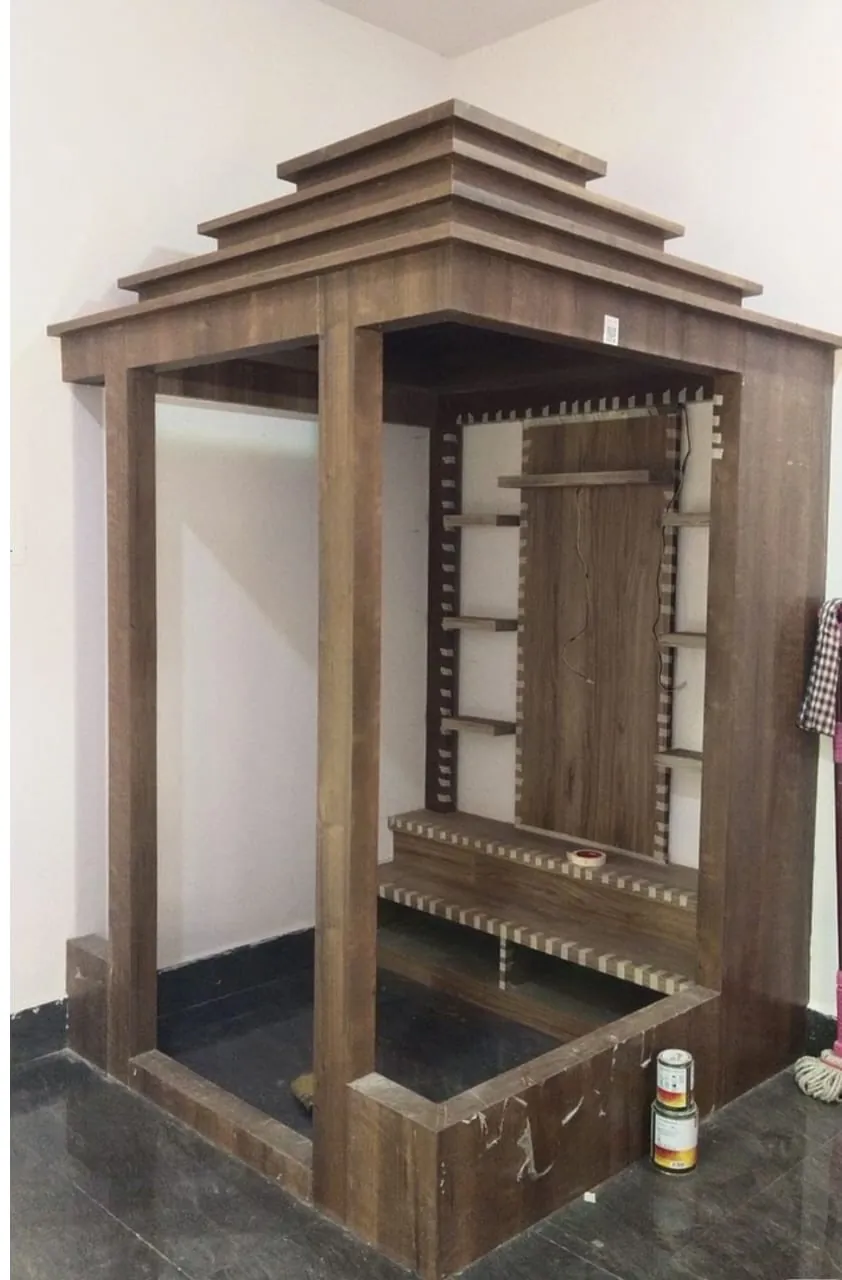 Wooden pooja mandir with traditional carving and backlit jaali